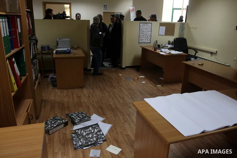 Palestinian Prime Minister Salam Fayyad, left, visits the offices of al-Watan TV after an Israeli army pre-dawn raid in the West Bank city of Ramallah, Wednesday, Feb. 29, 2012. A Palestinian broadcaster says Israeli tro...