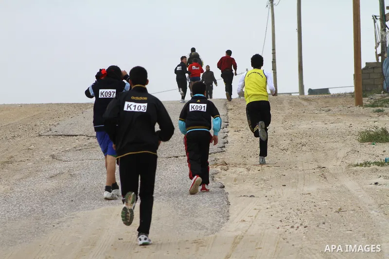 Participants compete in the UN-sponsored Gaza marathon in Gaza City on March 1, 2012. Thousands of runners braved temperatures hovering just above zero degrees centigrade to take part in the impoverished Palestinian terr...