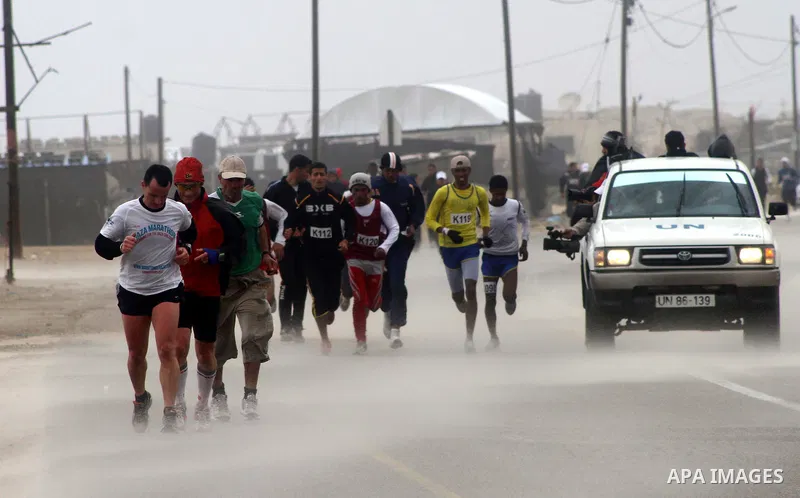 Participants compete in the UN-sponsored Gaza marathon in Gaza City on March 1, 2012. Thousands of runners braved temperatures hovering just above zero degrees centigrade to take part in the impoverished Palestinian terr...