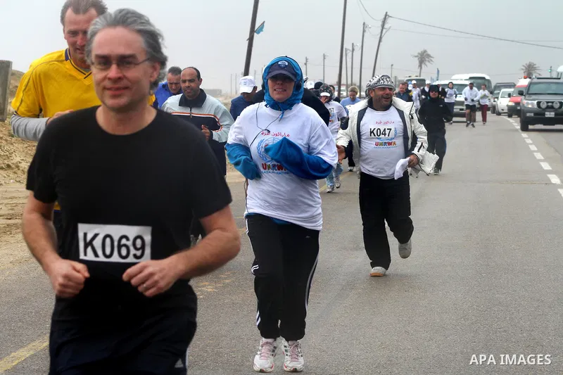 Participants compete in the UN-sponsored Gaza marathon in Gaza City on March 1, 2012. Thousands of runners braved temperatures hovering just above zero degrees centigrade to take part in the impoverished Palestinian terr...