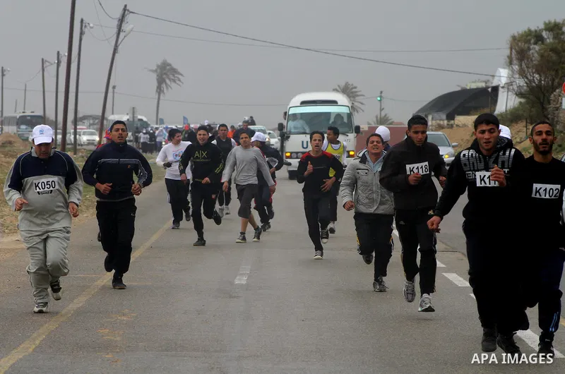 Participants compete in the UN-sponsored Gaza marathon in Gaza City on March 1, 2012. Thousands of runners braved temperatures hovering just above zero degrees centigrade to take part in the impoverished Palestinian terr...