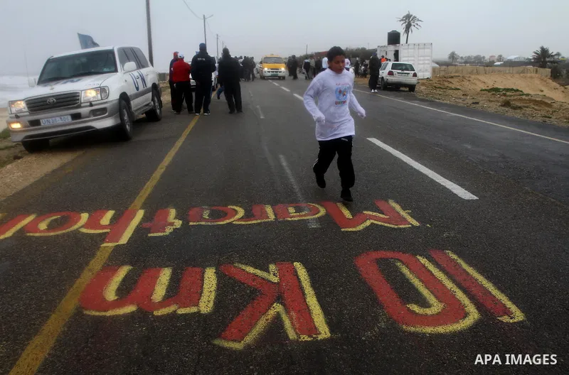 Participants compete in the UN-sponsored Gaza marathon in Gaza City on March 1, 2012. Thousands of runners braved temperatures hovering just above zero degrees centigrade to take part in the impoverished Palestinian terr...