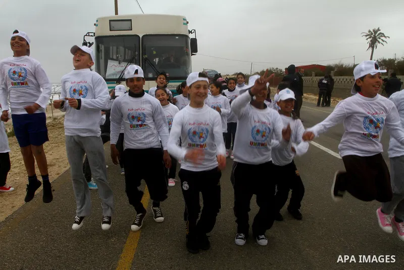 Participants compete in the UN-sponsored Gaza marathon in Gaza City on March 1, 2012. Thousands of runners braved temperatures hovering just above zero degrees centigrade to take part in the impoverished Palestinian terr...