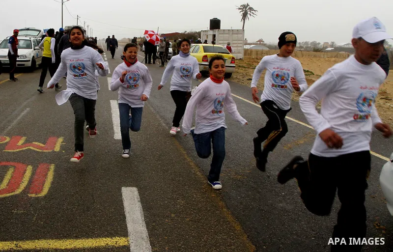 Participants compete in the UN-sponsored Gaza marathon in Gaza City on March 1, 2012. Thousands of runners braved temperatures hovering just above zero degrees centigrade to take part in the impoverished Palestinian terr...