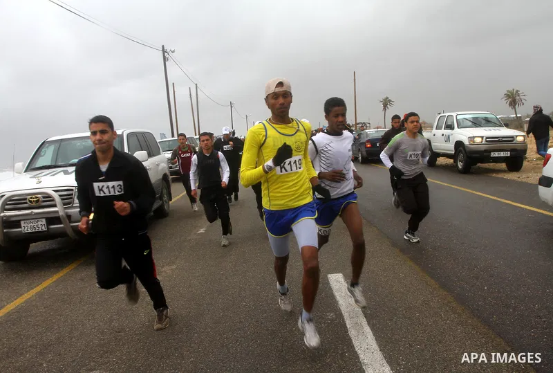 Participants compete in the UN-sponsored Gaza marathon in Gaza City on March 1, 2012. Thousands of runners braved temperatures hovering just above zero degrees centigrade to take part in the impoverished Palestinian terr...