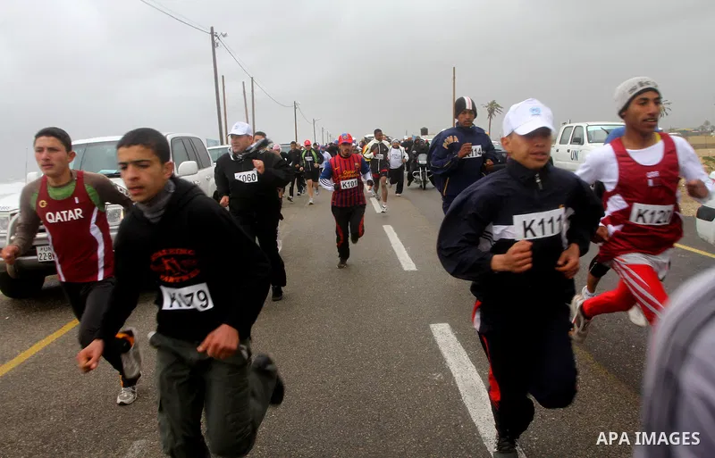 Participants compete in the UN-sponsored Gaza marathon in Gaza City on March 1, 2012. Thousands of runners braved temperatures hovering just above zero degrees centigrade to take part in the impoverished Palestinian terr...