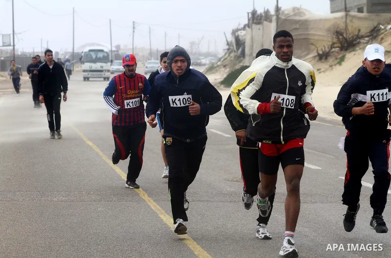 Participants compete in the UN-sponsored Gaza marathon in Gaza City on March 1, 2012. Thousands of runners braved temperatures hovering just above zero degrees centigrade to take part in the impoverished Palestinian terr...