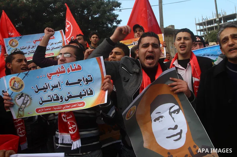 Palestinians demonstrate in solidarity with Hana'a Shalabi during a protest in Gaza City, on mar. 05, 2012. Shalabi, released by Israel in a prisoner swap last year but re-arrested earlier this month and held without cha...