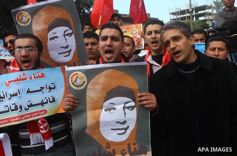 Palestinians demonstrate in solidarity with Hana'a Shalabi during a protest in Gaza City, on mar. 05, 2012. Shalabi, released by Israel in a prisoner swap last year but re-arrested earlier this month and held without cha...