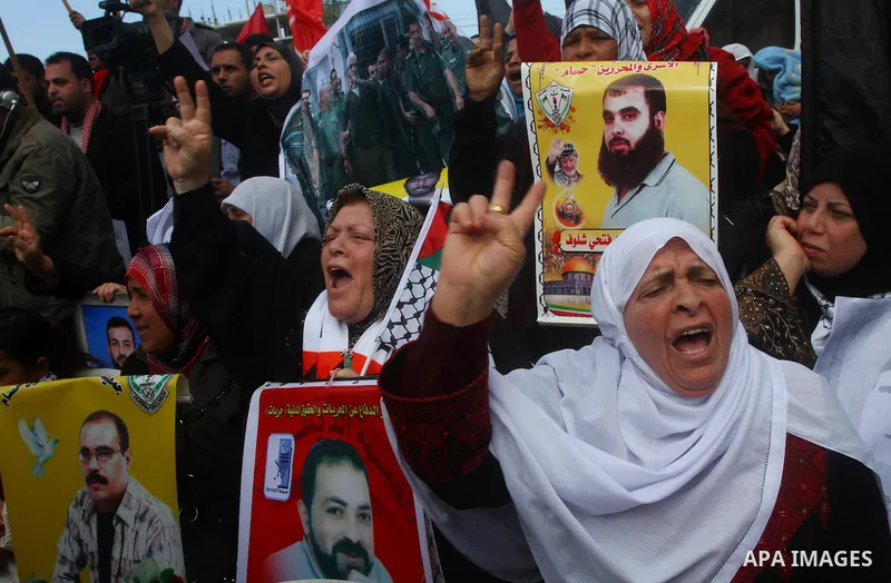 Palestinians demonstrate in solidarity with Hana'a Shalabi during a protest in Gaza City, on mar. 05, 2012. Shalabi, released by Israel in a prisoner swap last year but re-arrested earlier this month and held without cha...