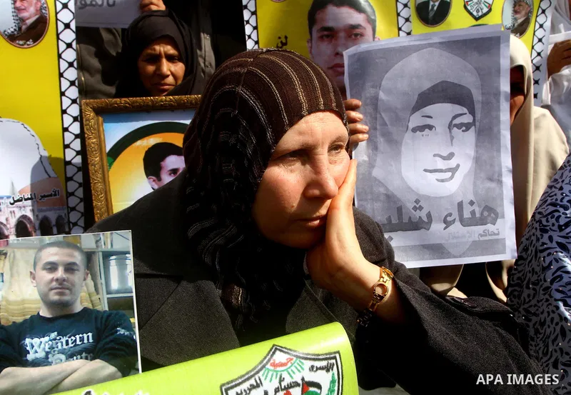 Palestinians demonstrate in solidarity with Hana'a Shalabi during a protest in Gaza City, on mar. 05, 2012. Shalabi, released by Israel in a prisoner swap last year but re-arrested earlier this month and held without cha...
