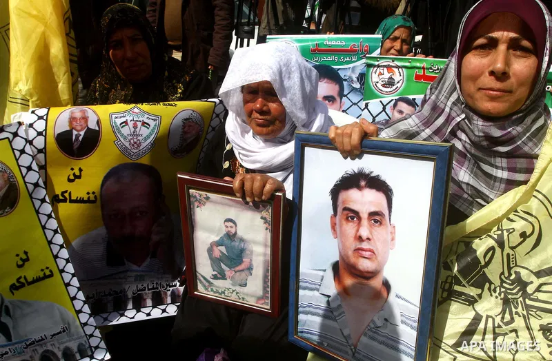 Palestinians demonstrate in solidarity with Hana'a Shalabi during a protest in Gaza City, on mar. 05, 2012. Shalabi, released by Israel in a prisoner swap last year but re-arrested earlier this month and held without cha...