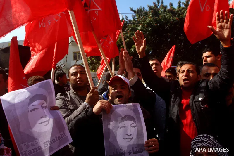 Palestinians demonstrate in solidarity with Hana'a Shalabi during a protest in Gaza City, on mar. 05, 2012. Shalabi, released by Israel in a prisoner swap last year but re-arrested earlier this month and held without cha...