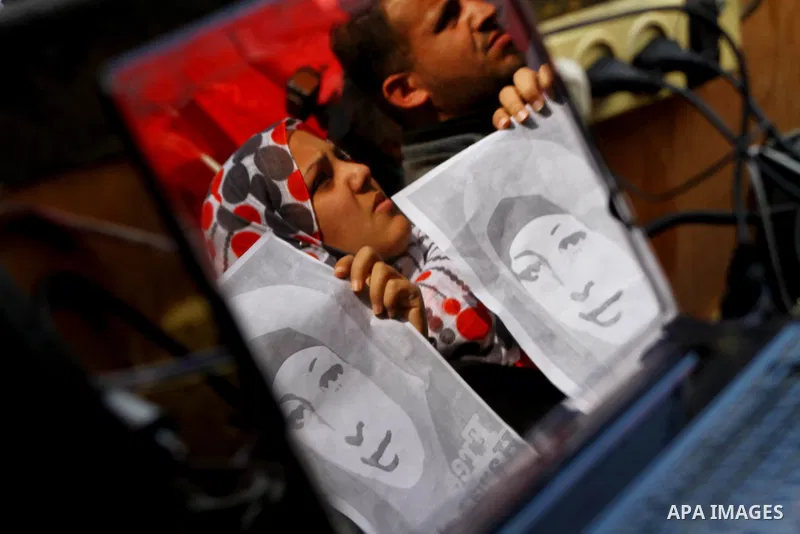 Palestinians demonstrate in solidarity with Hana'a Shalabi during a protest in Gaza City, on mar. 05, 2012. Shalabi, released by Israel in a prisoner swap last year but re-arrested earlier this month and held without cha...