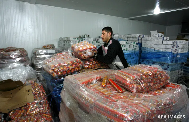 Palestinian workers employed in the warehouses of refrigerators for goods in Nusseirat refugee camp in central Gaza Strip on March 5, 2012. While the owners of freezers traders suffer from power cuts and lack of diesel f...