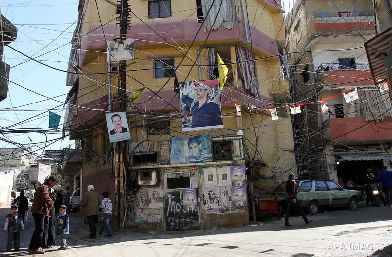 Palestinians walk in alley in one of the most poor regions at Burj al-Barajneh Palestinian refugee camp in Beirut, in Lebanon, March 5, 2012. About 25,000 person live in this poor refugee camp who face hard and difficult...