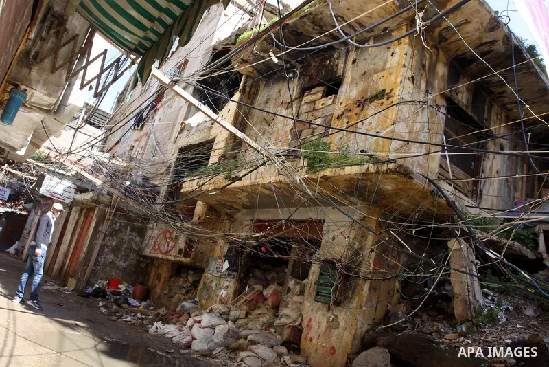 Palestinians walk in alley in one of the most poor regions at Burj al-Barajneh Palestinian refugee camp in Beirut, in Lebanon, March 5, 2012. About 25,000 person live in this poor refugee camp who face hard and difficult...