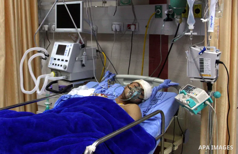 Palestinian Mohammed Abu-Awad, 19, injured by Israeli soldiers at a checkpoint near Ramallah earlier, receives treatment in hospital in the West Bank city of Ramallah, Monday, March 5, 2012. A young Palestinian man throw...