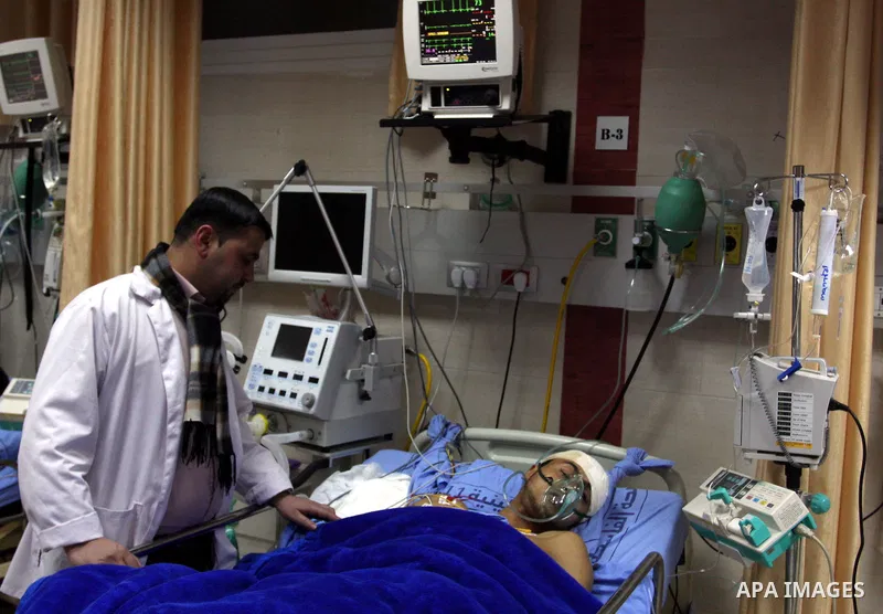 Palestinian Mohammed Abu-Awad, 19, injured by Israeli soldiers at a checkpoint near Ramallah earlier, receives treatment in hospital in the West Bank city of Ramallah, Monday, March 5, 2012. A young Palestinian man throw...