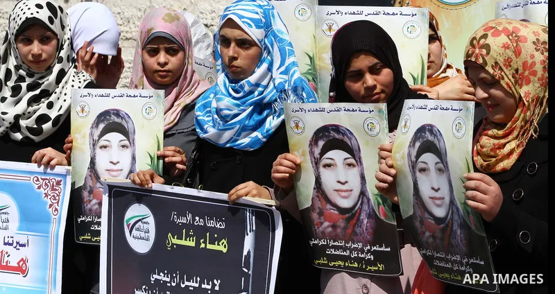 A Palestinian students of university demonstrate in solidarity with Hana'a Shalabi during a protest in front of red cross in Gaza City, on mar. 06, 2012. Shalabi, released by Israel in a prisoner swap last year but re-ar...