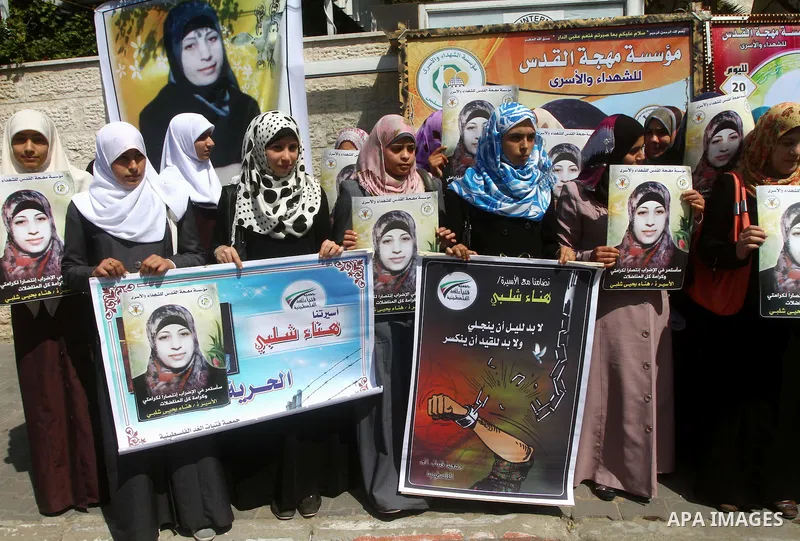 A Palestinian students of university demonstrate in solidarity with Hana'a Shalabi during a protest in front of red cross in Gaza City, on mar. 06, 2012. Shalabi, released by Israel in a prisoner swap last year but re-ar...