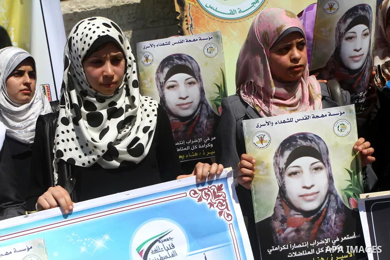 A Palestinian students of university demonstrate in solidarity with Hana'a Shalabi during a protest in front of red cross in Gaza City, on mar. 06, 2012. Shalabi, released by Israel in a prisoner swap last year but re-ar...