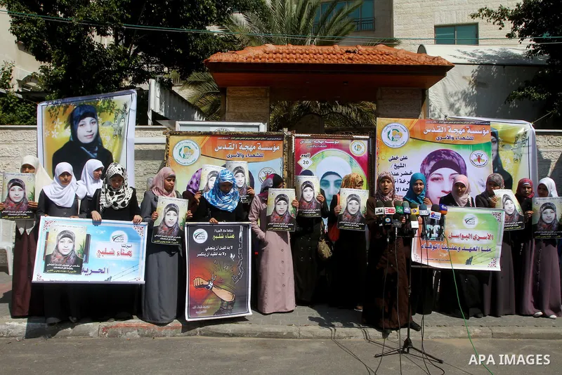 A Palestinian students of university demonstrate in solidarity with Hana'a Shalabi during a protest in front of red cross in Gaza City, on mar. 06, 2012. Shalabi, released by Israel in a prisoner swap last year but re-ar...