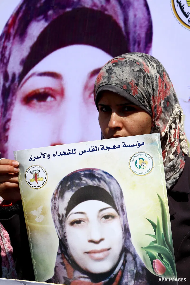 A Palestinian students of university demonstrate in solidarity with Hana'a Shalabi during a protest in front of red cross in Gaza City, on mar. 06, 2012. Shalabi, released by Israel in a prisoner swap last year but re-ar...