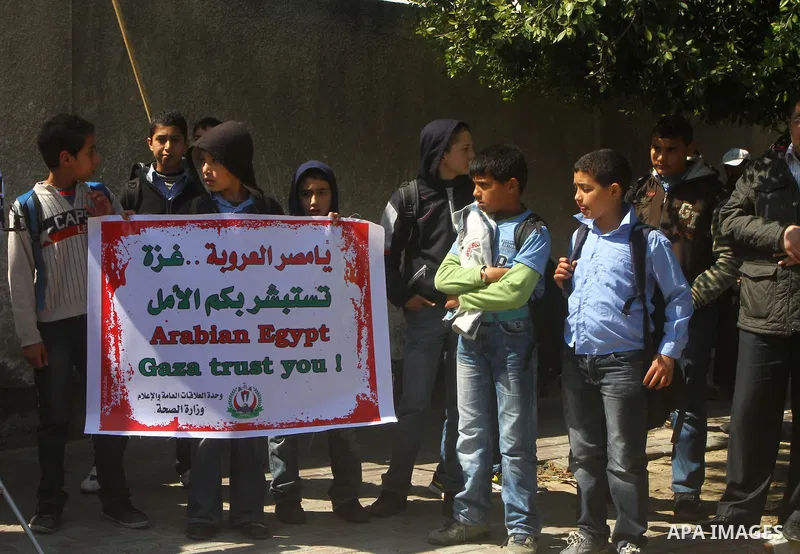 A Palestinian students take part in a protest in front of Egyptian Embassy in Gaza, calling for supplying the Gaza Strip with enough fuel on Mar. 06, 2012. Photo by Ashraf Amra
