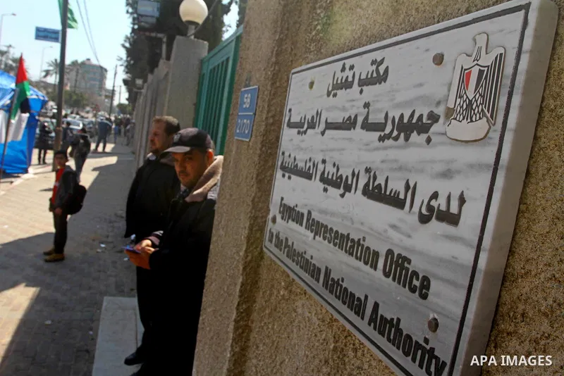A Palestinian member of Hamas stands near of Egyptian Embassy during protests calling for supplying the Gaza Strip with enough fuel on Mar. 06, 2012. Photo by Ashraf Amra