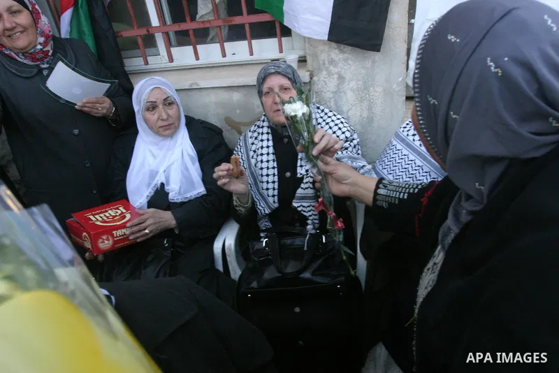 Palestinian women take part in marking the International Woman's Day in the Sheikh Jarrah in Jerusalem's Old City's , on March 8, 2012. Photo by Mahfouz Abu Turk