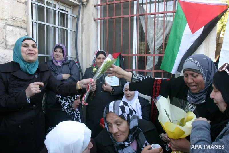 Palestinian women take part in marking the International Woman's Day in the Sheikh Jarrah in Jerusalem's Old City's , on March 8, 2012. Photo by Mahfouz Abu Turk