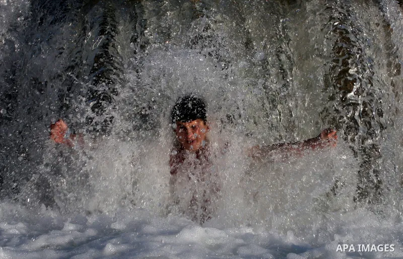 Palestinian children Swimming in the waters of "Wadi Ain Qeigna" in West Bank near Ramallah City, 6 March 2012. Photo by Issam Rimawi