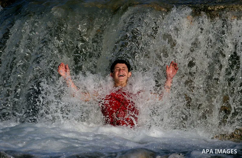Palestinian children Swimming in the waters of "Wadi Ain Qeigna" in West Bank near Ramallah City, 6 March 2012. Photo by Issam Rimawi
