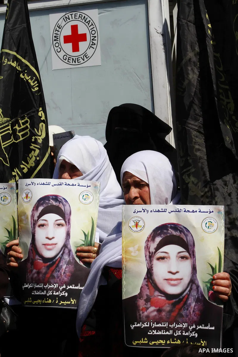 Palestinian women demonstrate in solidarity with Hana'a Shalabi during a protest in front of red cross in Gaza City, on mar. 07, 2012. Shalabi, released by Israel in a prisoner swap last year but re-arrested earlier this...