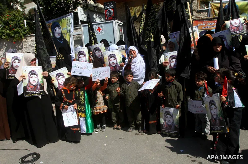 Palestinian women demonstrate in solidarity with Hana'a Shalabi during a protest in front of red cross in Gaza City, on mar. 07, 2012. Shalabi, released by Israel in a prisoner swap last year but re-arrested earlier this...