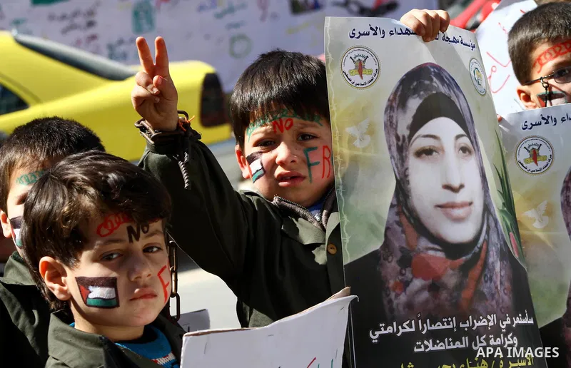Palestinian children demonstrate in solidarity with Hana'a Shalabi during a protest in front of red cross in Gaza City, on mar. 07, 2012. Shalabi, released by Israel in a prisoner swap last year but re-arrested earlier t...