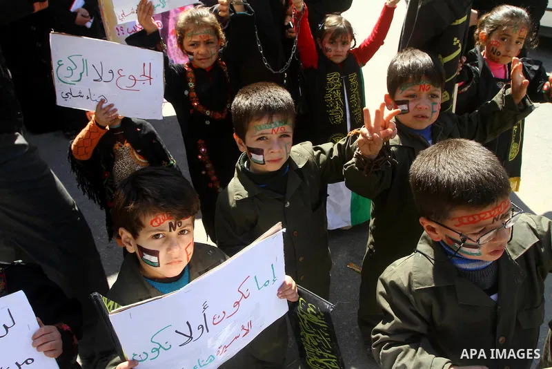 Palestinian children demonstrate in solidarity with Hana'a Shalabi during a protest in front of red cross in Gaza City, on mar. 07, 2012. Shalabi, released by Israel in a prisoner swap last year but re-arrested earlier t...