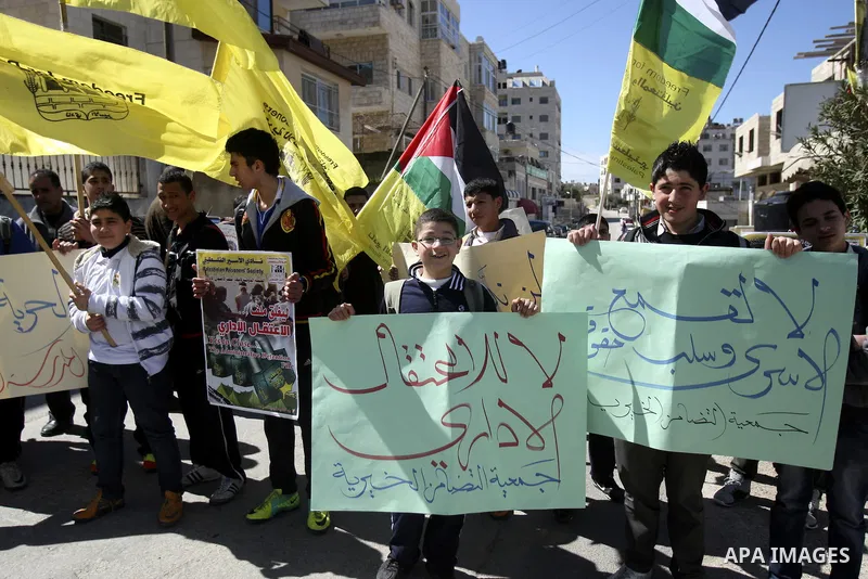 Palestinians take part in a protest in solidarity with Hana Shalabi, a Palestinian prisoner jailed in Israel and who has been on hunger strike for 21 days, in the West Bank in Nablus, Wednesday, March 7, 2012. Palestinia...