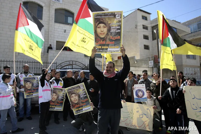 Palestinians take part in a protest in solidarity with Hana Shalabi, a Palestinian prisoner jailed in Israel and who has been on hunger strike for 21 days, in the West Bank in Nablus, Wednesday, March 7, 2012. Palestinia...
