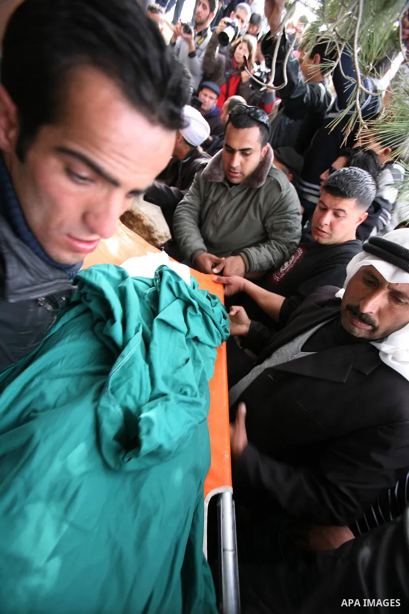 Palestinian mourners carry the bodies of two boys who were killed the previous day when unexploded military ordinance detonated outside Hebron, during their funeral in Wadi al-Rim, West Bank, 07 March 2012. Palestinian p...