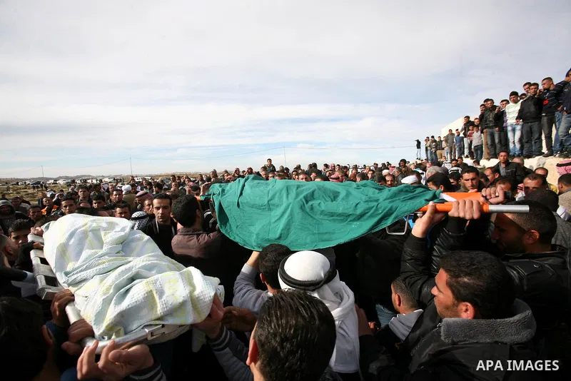 Palestinian mourners carry the bodies of two boys who were killed the previous day when unexploded military ordinance detonated outside Hebron, during their funeral in Wadi al-Rim, West Bank, 07 March 2012. Palestinian p...