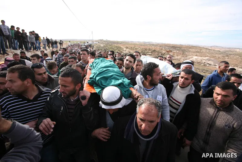 Palestinian mourners carry the bodies of two boys who were killed the previous day when unexploded military ordinance detonated outside Hebron, during their funeral in Wadi al-Rim, West Bank, 07 March 2012. Palestinian p...