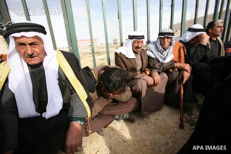Palestinian mourners carry the bodies of two boys who were killed the previous day when unexploded military ordinance detonated outside Hebron, during their funeral in Wadi al-Rim, West Bank, 07 March 2012. Palestinian p...