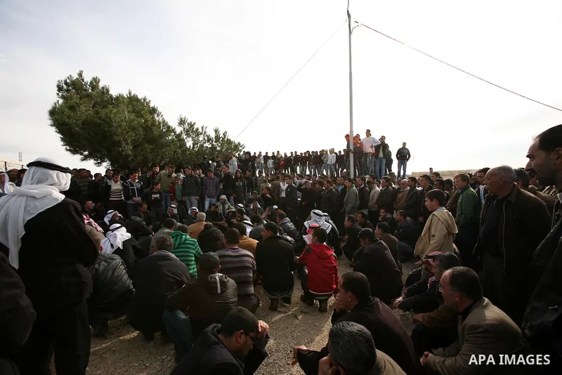 Palestinian mourners carry the bodies of two boys who were killed the previous day when unexploded military ordinance detonated outside Hebron, during their funeral in Wadi al-Rim, West Bank, 07 March 2012. Palestinian p...