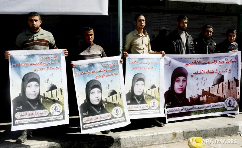 Palestinians demonstrate in solidarity with Hana'a Shalabi during a protest in Rafah, southern Gaza Strip on March 7, 2012. Shalabi, released by Israel in a prisoner swap last year but re-arrested earlier this month and...