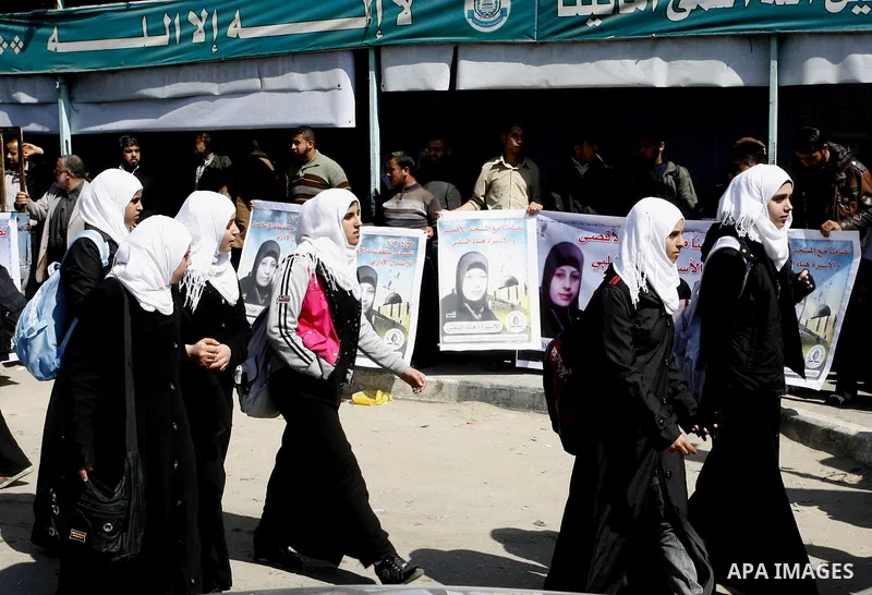 Palestinians demonstrate in solidarity with Hana'a Shalabi during a protest in Rafah, southern Gaza Strip on March 7, 2012. Shalabi, released by Israel in a prisoner swap last year but re-arrested earlier this month and...