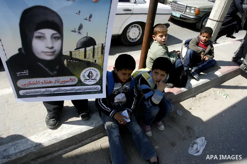 Palestinians demonstrate in solidarity with Hana'a Shalabi during a protest in Rafah, southern Gaza Strip on March 7, 2012. Shalabi, released by Israel in a prisoner swap last year but re-arrested earlier this month and...