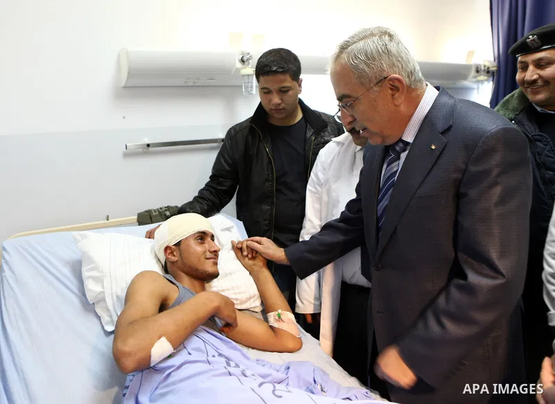 Palestinian Prime Minister Salam Fayyad, visits a hospital in the West Bank city of Ramallah, March 07, 2012. Photo by Mustafa Abu Dayah
