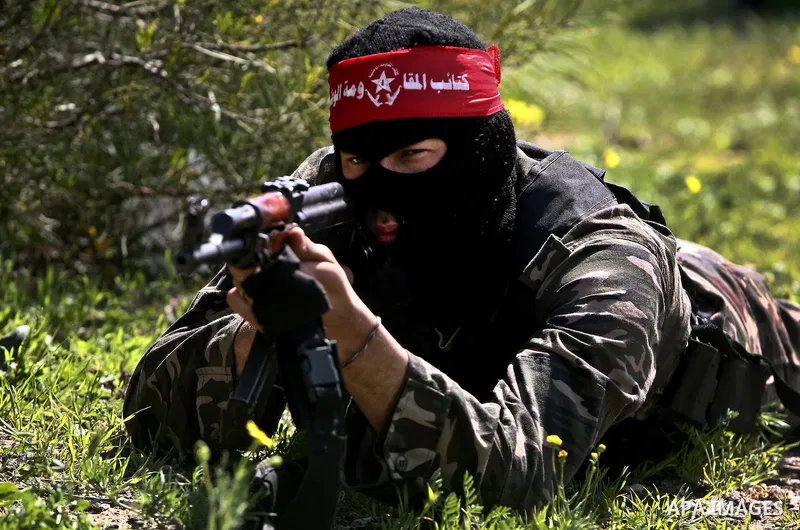 Palestinian militants of the Democratic Front for the Liberation of Palestine (DFLP) take part in a training exercise in front of the media in Rafah in the southern Gaza Strip, Mar. 08, 2012. Photo by Ali Jadallah